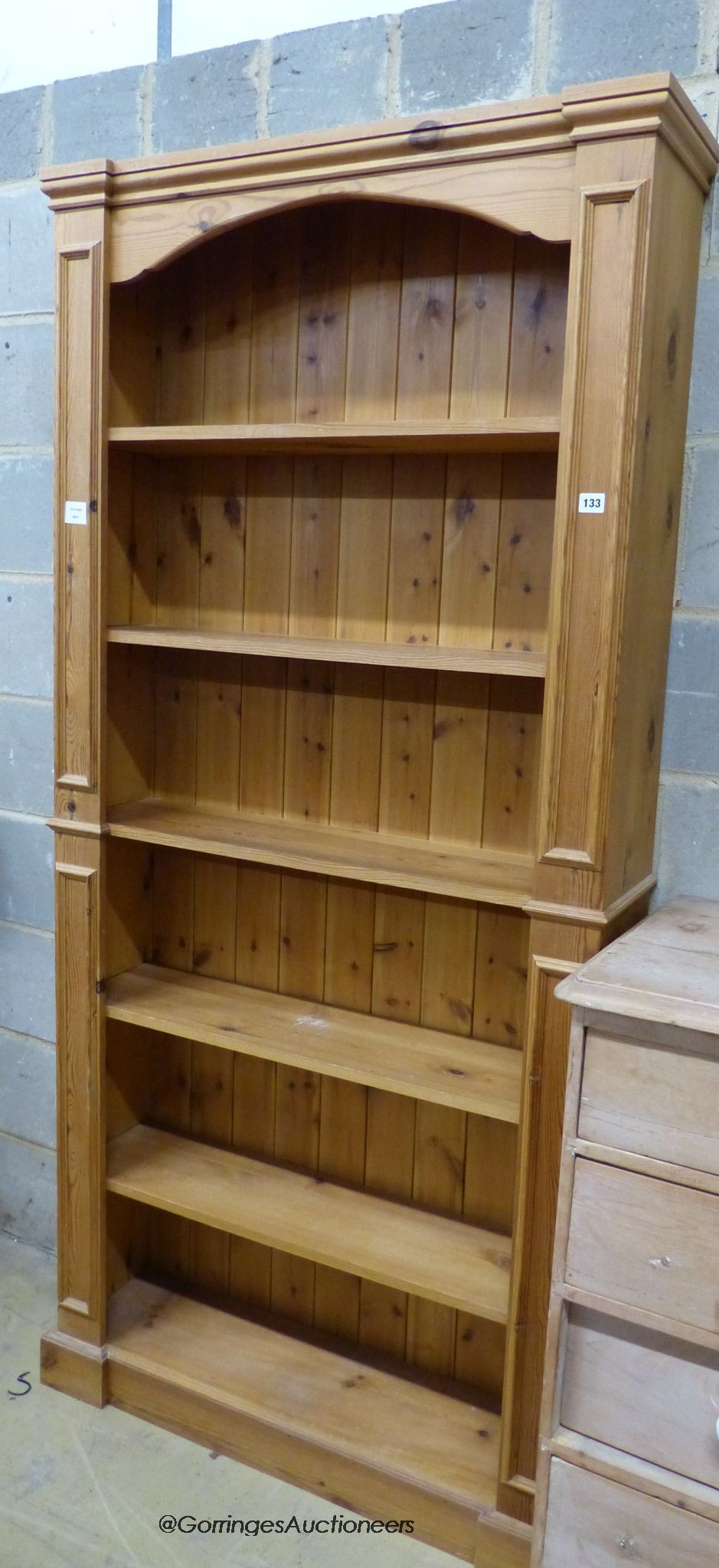 A reproduction tall pine open bookcase, length 94cm, depth 24cm, height 196cm